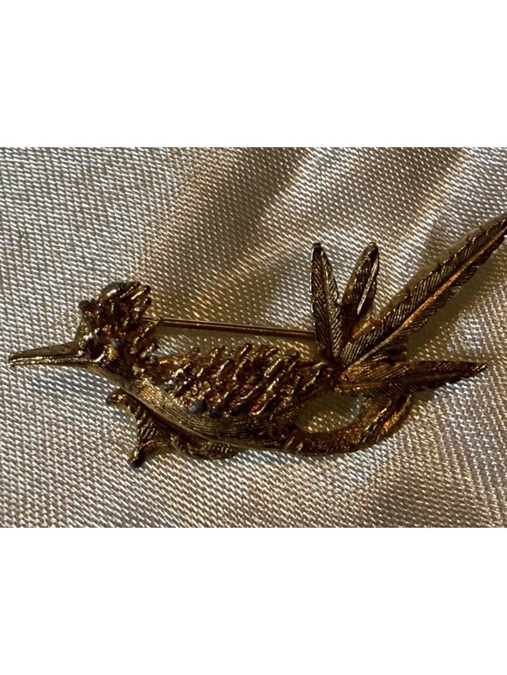 Gold tone bird lapel pin